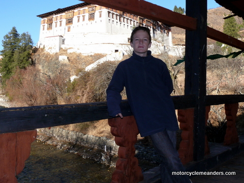 Dylan on bridge to Paro Dzong (background)