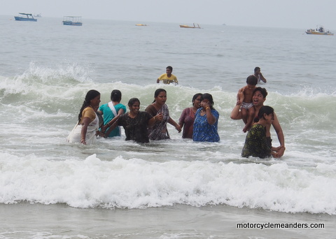 Ladies enjoying the surf in saris